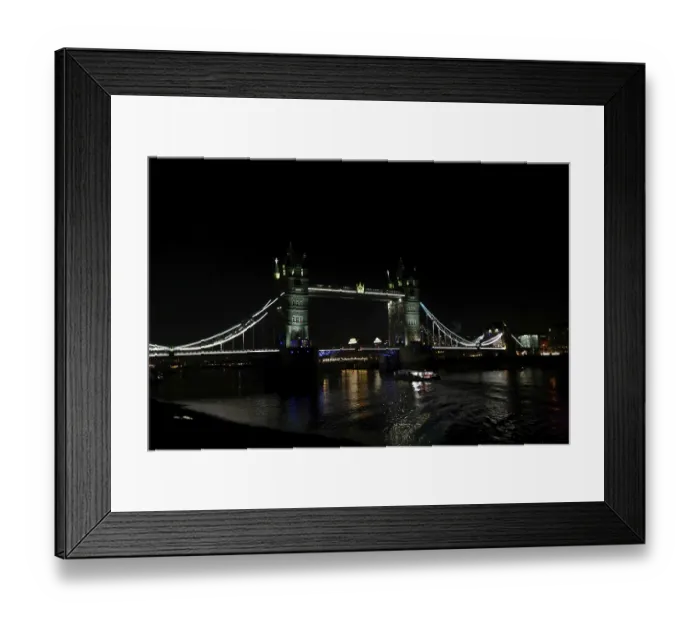 Framed Print : Darkened River Thames scene with the illuminated Tower Bridge creating a striking visual effect in London
