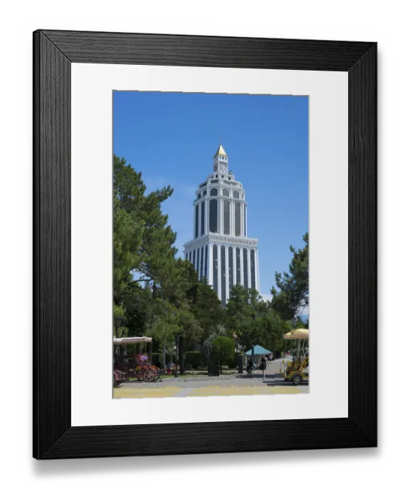 Framed Print : Tall white building in the park with carriages in the foreground and clear sunny sky