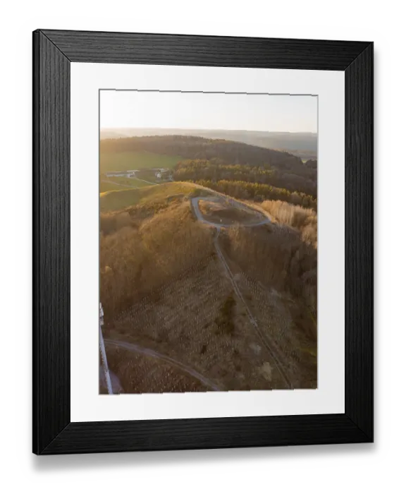 Framed Print : Extensive forest landscape with a path on the hill at sunset Framed Print : Extensive forest landscape with a path on the hill at sunset