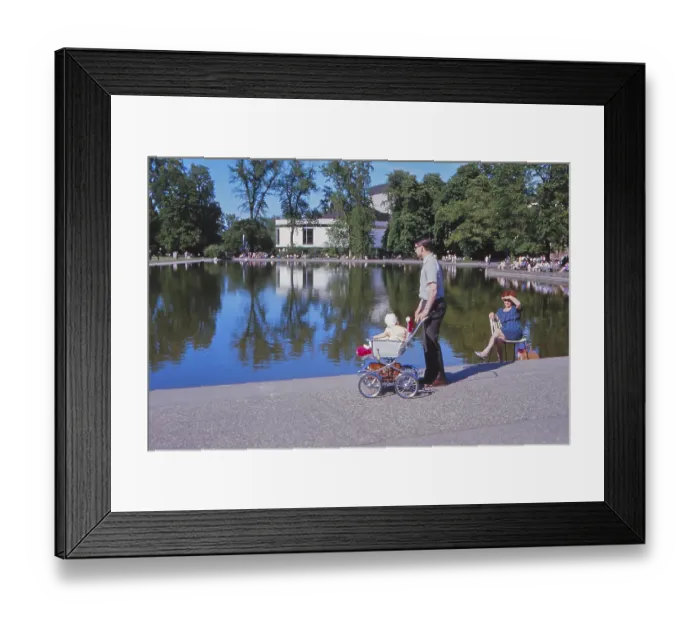 Framed Print : Young father with stroller many people sitting on chairs in the sun in 1967 at Eckensee Framed Print : Young father with stroller many people sitting on chairs in the sun in 1967 at Eckensee