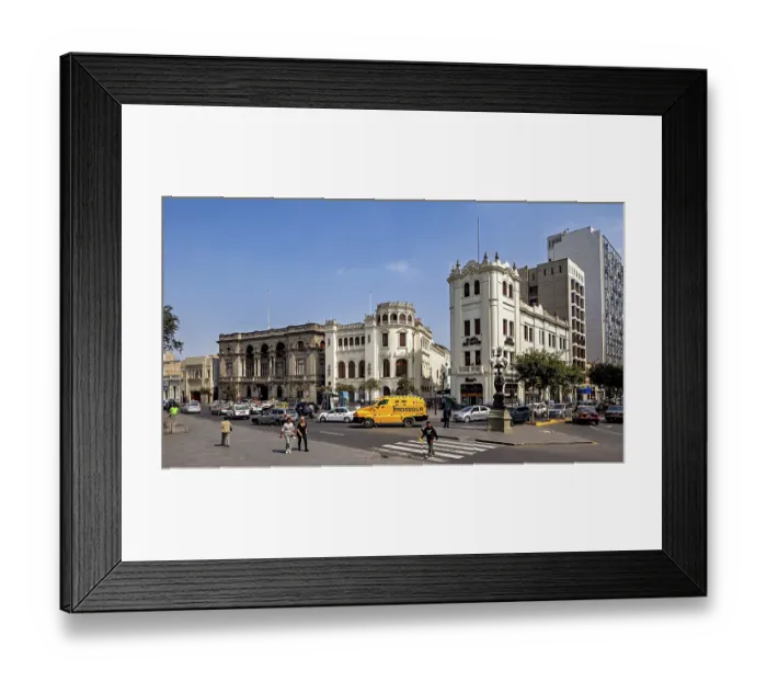 Framed Print : Distinctive historic buildings at a busy crossroads under blue skies Framed Print : Distinctive historic buildings at a busy crossroads under blue skies