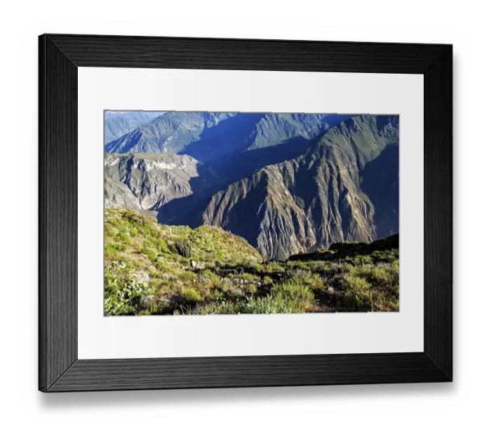 Framed Print : Steep mountain valleys with lush vegetation and distinctive shadows