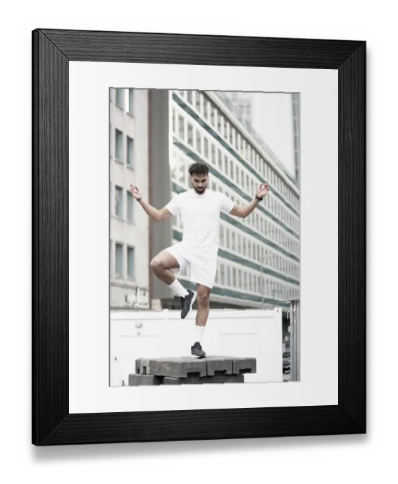 Framed Print : Man doing Yoga pose in city with Mudra hand sign Framed Print : Man doing Yoga pose in city with Mudra hand sign