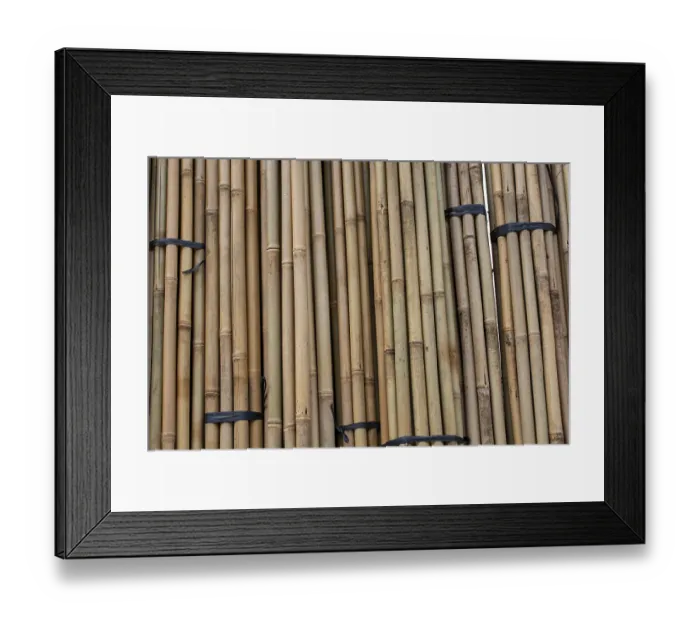 Framed Print : Close up full frame texture of vertical dry brown bamboo poles arranged as a natural fence Framed Print : Close up full frame texture of vertical dry brown bamboo poles arranged as a natural fence
