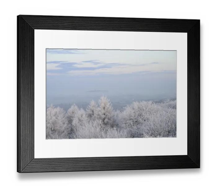 Framed Print : Snowy range of hills with frosty trees in the morning light