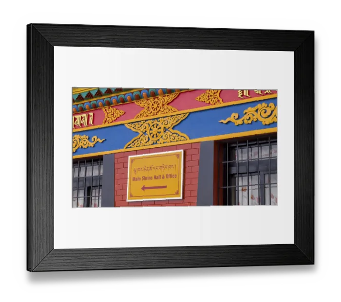 Framed Print : Colourfully decorated facade with a sign in two languages referring to a main sanctuary and office Framed Print : Colourfully decorated facade with a sign in two languages referring to a main sanctuary and office