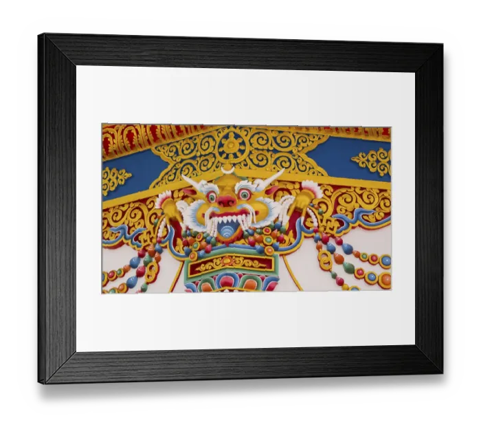 Framed Print : A colorful temple style dragon wall of ornamentation and Buddhist symbols