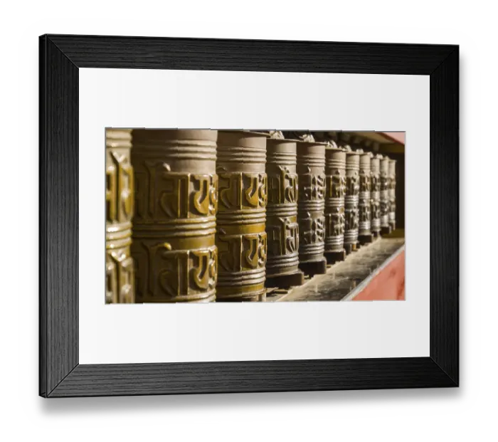 Framed Print : Metal prayer wheels in a row, artfully decorated Framed Print : Metal prayer wheels in a row, artfully decorated