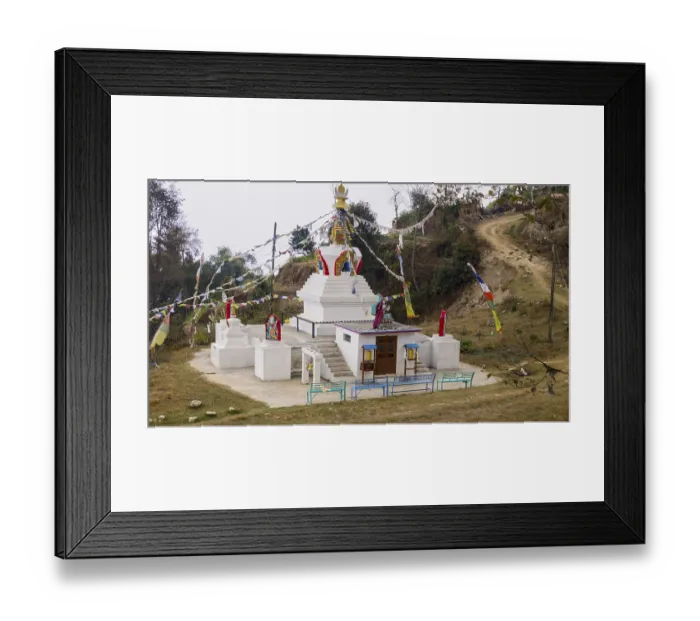 Framed Print : Small stupa with colorful prayer flags on a hill