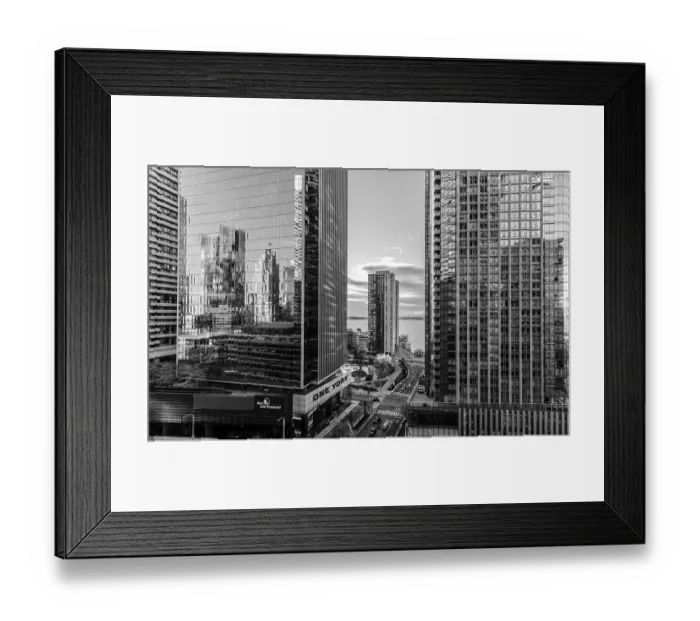 Framed Print : Black and white view of skyscrapers with reflective surfaces and cloudy sky in Toronto