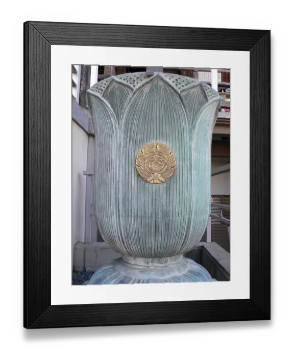 Framed Print : Buddhist symbol of lotus flower on the religios water cup near temple