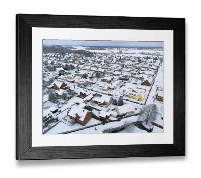 Framed Print : Snowy residential area with close-standing houses and snow-covered roads