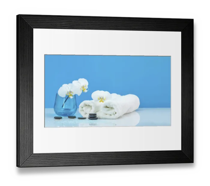 Framed Print : Spa Moth orchid with soft towel and massage stones setting