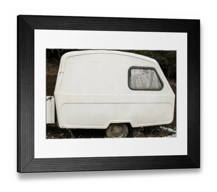 Framed Print : Old abandoned weathered small white vintage caravan