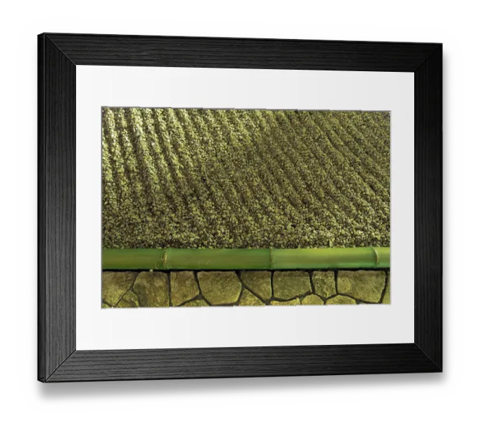 Framed Print : Zen stone garden fragment under vivid night illumination with sand waves and bamboo pole border