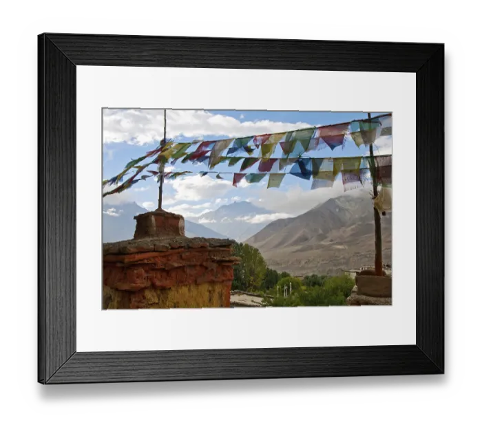 Framed Print : The Chorten and prayer flags on a background of mountains and clouds Framed Print : The Chorten and prayer flags on a background of mountains and clouds