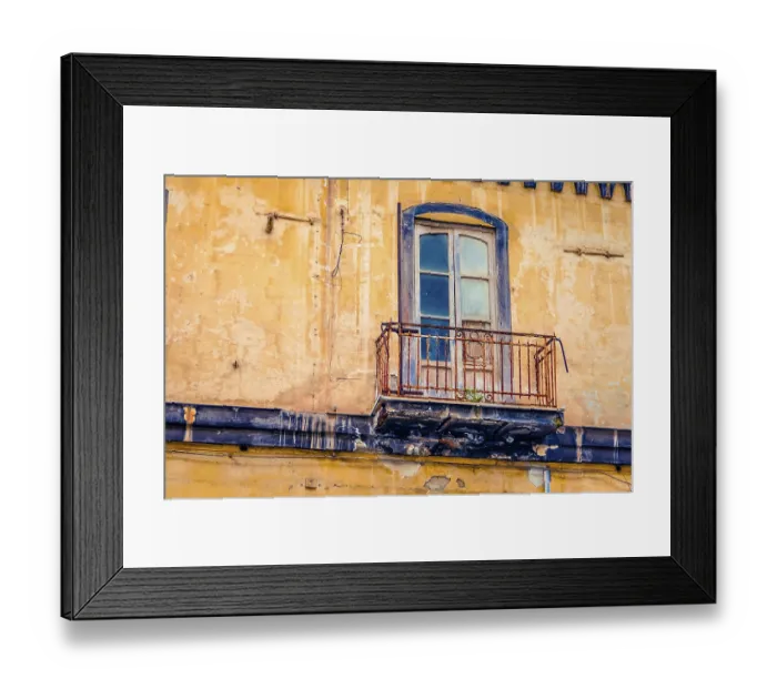 Framed Print : Vintage balcony on an old abandoned and decaying house facade in Italy Framed Print : Vintage balcony on an old abandoned and decaying house facade in Italy