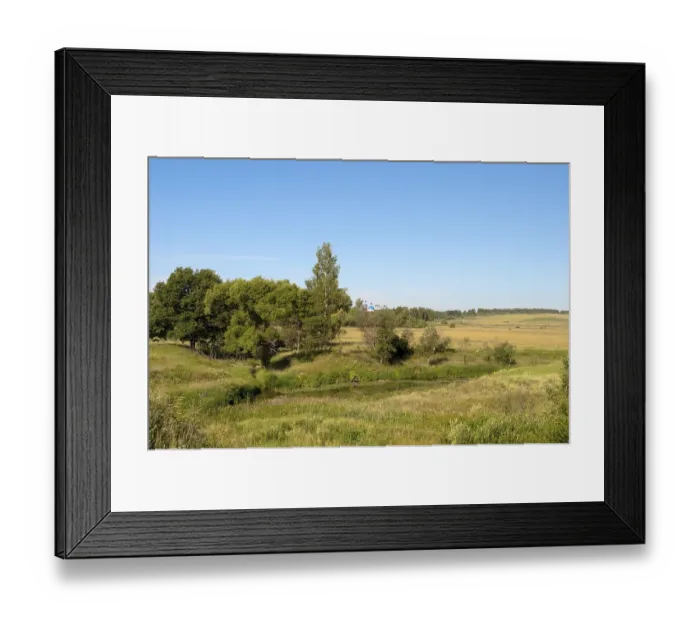 Framed Print : Rural landscape with a small river and sloping field Framed Print : Rural landscape with a small river and sloping field