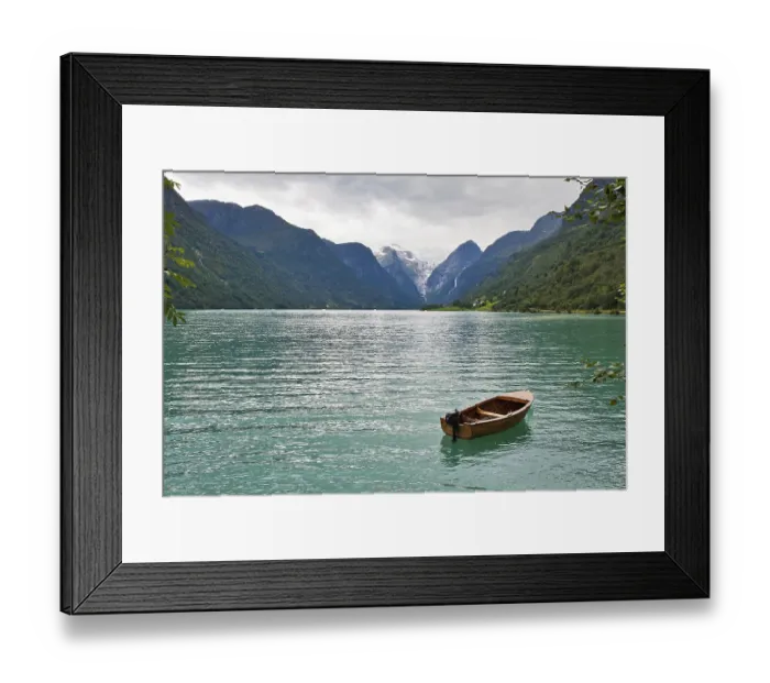 Framed Print : The Norwegian landscape with a boat on lake against mountains