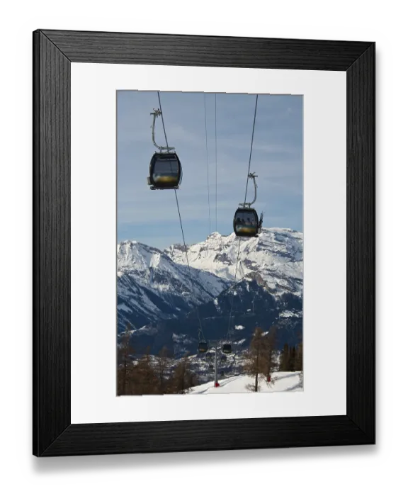 Framed Print : Rope-way against a background of snow-capped peaks