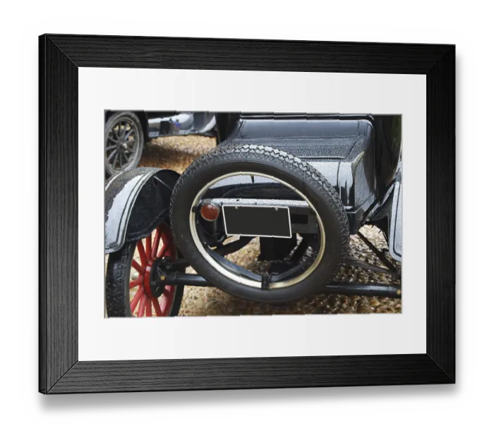 Framed Print : Black retro car back side, spare wheel closeup Framed Print : Black retro car back side, spare wheel closeup