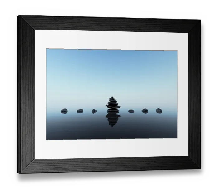 Framed Print : Stacked black stones with reflections on blue clean background