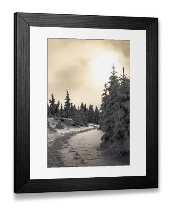 Framed Print : A picturesque trail snakes through a wintery snow-covered coniferous forest under a hazy sky in the magical