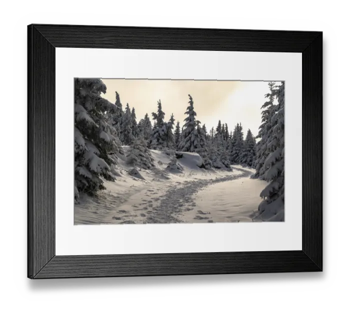 Framed Print : A picturesque trail snakes through a wintery snow-covered coniferous forest under a hazy sky in the magical
