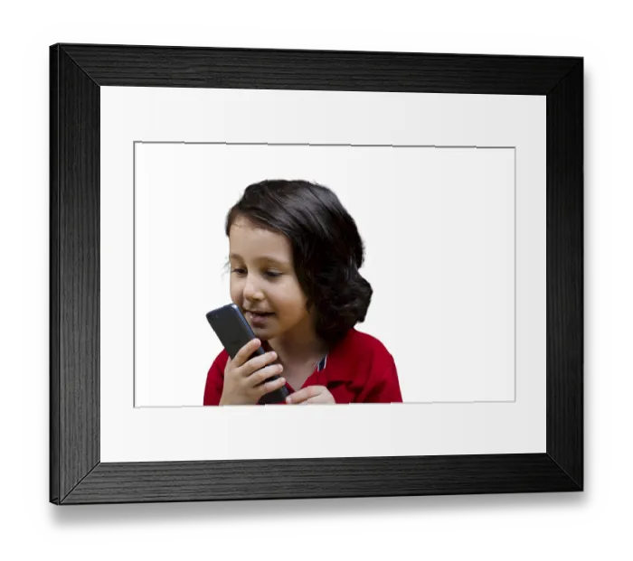 Framed Print : Boy with mobile phone in hand isolated on a white background