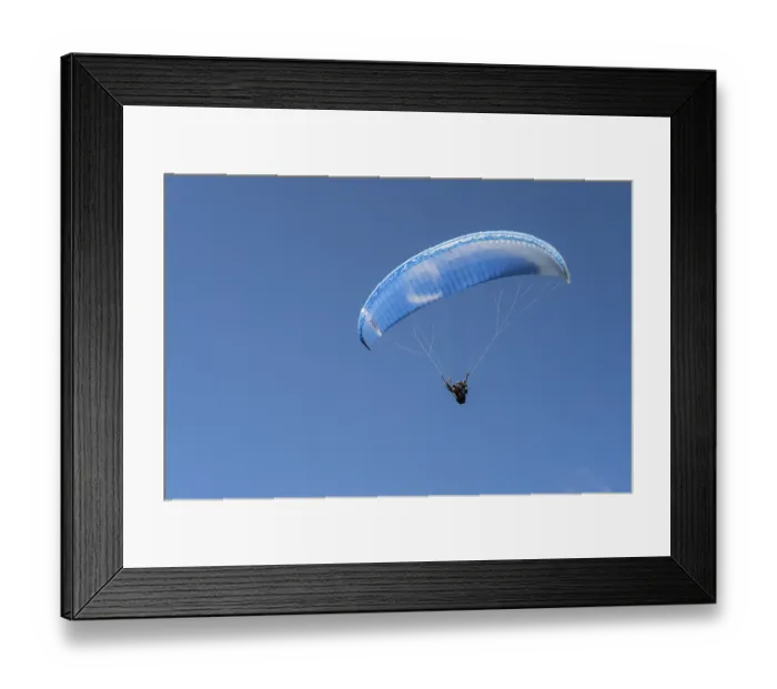 Framed Print : Single paraglider in the blue sky symbolizing freedom and adventure