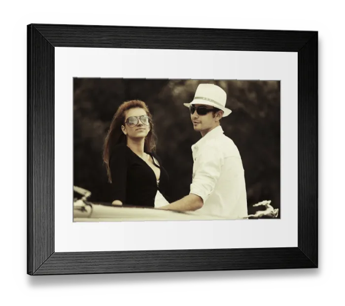 Framed Print : Young fashion couple at the classic car