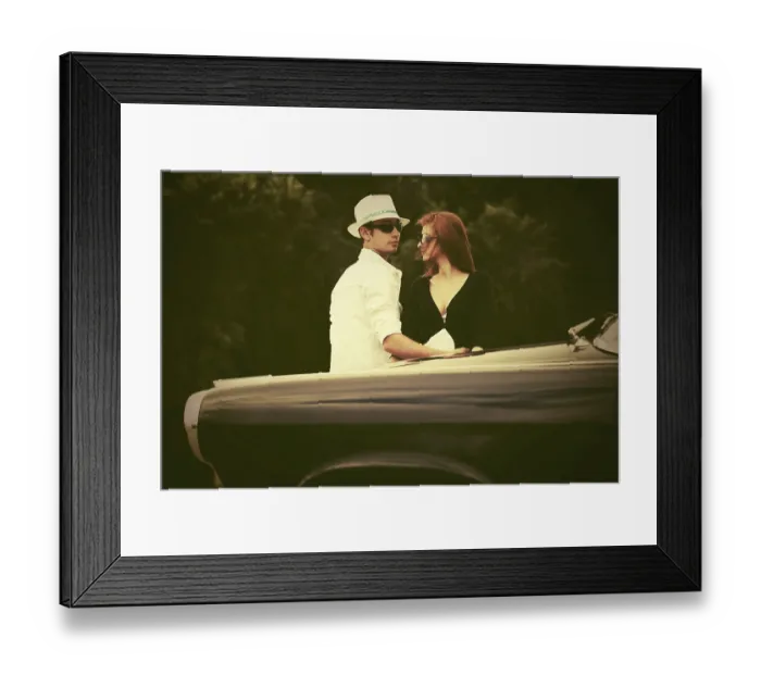Framed Print : Young fashion couple in love next to vintage car Framed Print : Young fashion couple in love next to vintage car