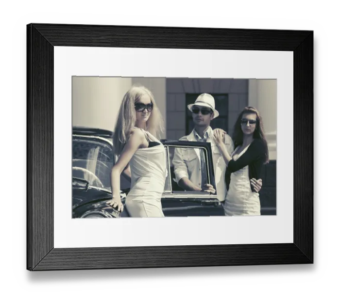Framed Print : Young fashion people next to vintage car in city street