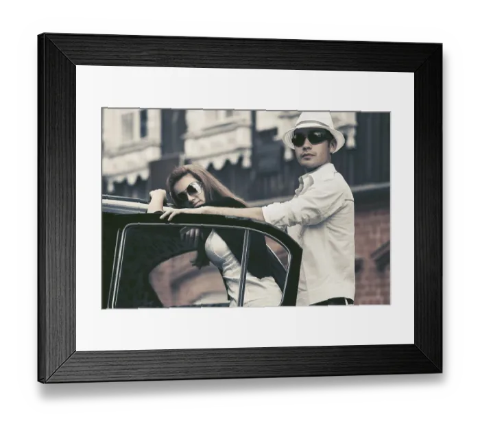 Framed Print : Happy young fashion couple next to vintage car
