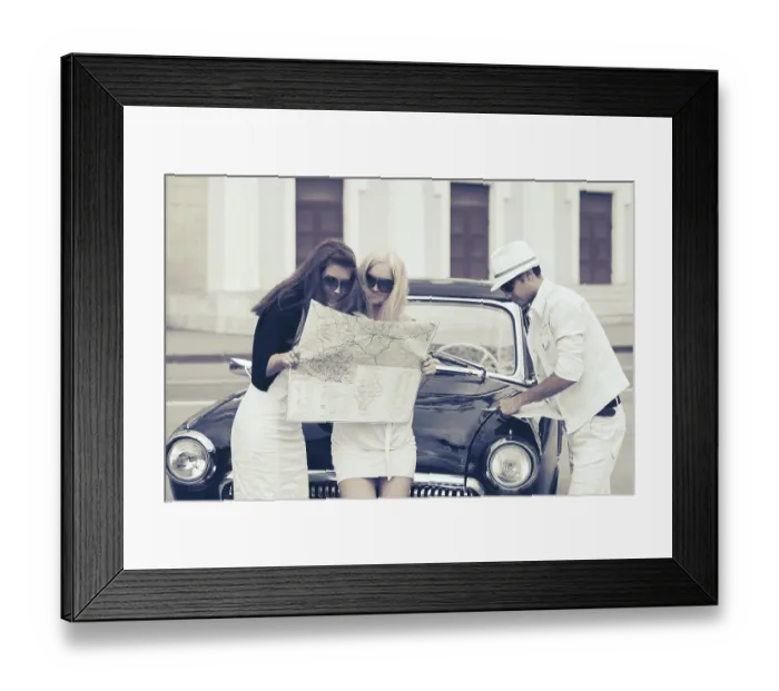 Framed Print : Young fashion people with a road map next to vintage car Framed Print : Young fashion people with a road map next to vintage car