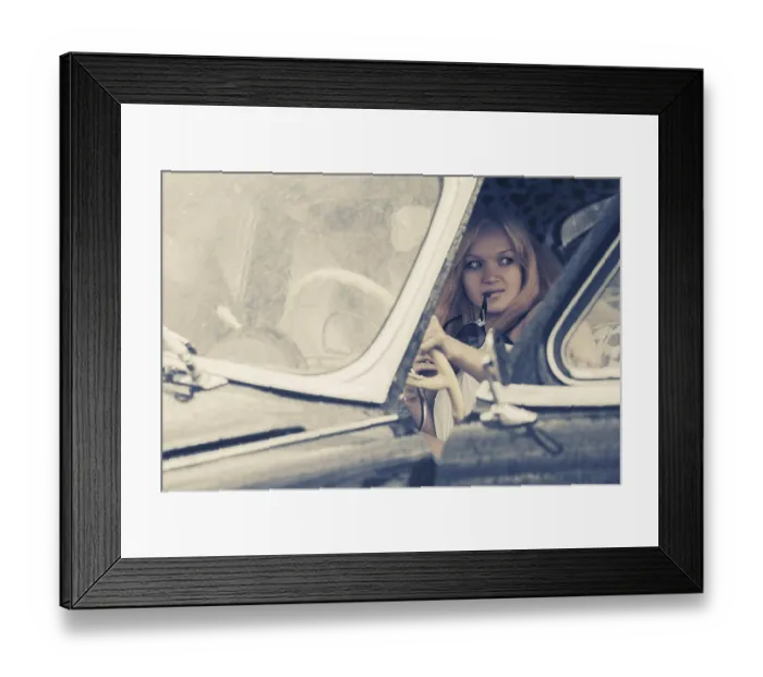 Framed Print : Young fashion couple driving vintage car