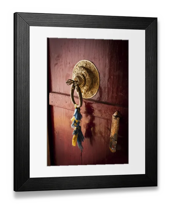Framed Print : Old door at Buddhist monastery temple decorated with ancient doorknob and tassel