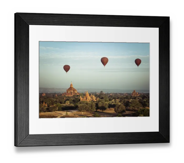 Framed Print : Hot air balloons flying at sunrise over ancient Buddhist Temples at Bagan Framed Print : Hot air balloons flying at sunrise over ancient Buddhist Temples at Bagan