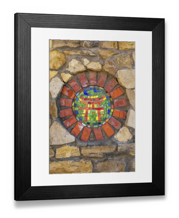 Framed Print : Circular mosaic religious symbol of Shinto on stone wall