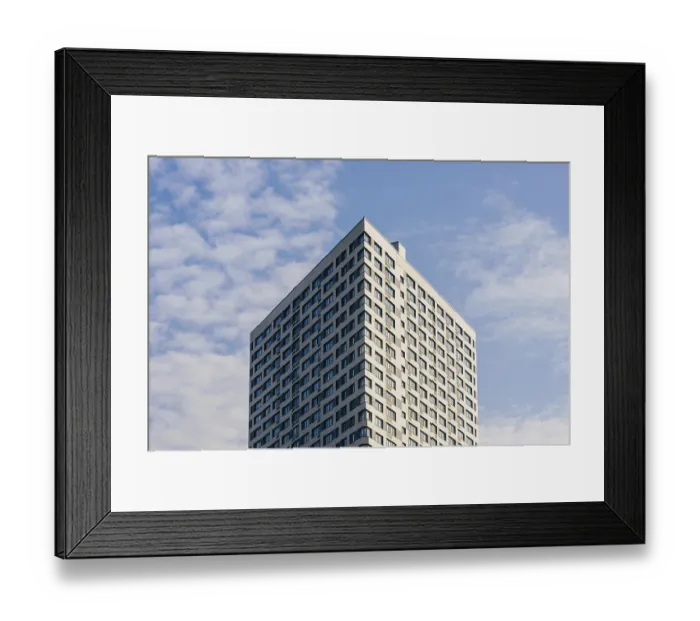 Framed Print : Modern Skyscraper on the Cloudy Sky Background Framed Print : Modern Skyscraper on the Cloudy Sky Background