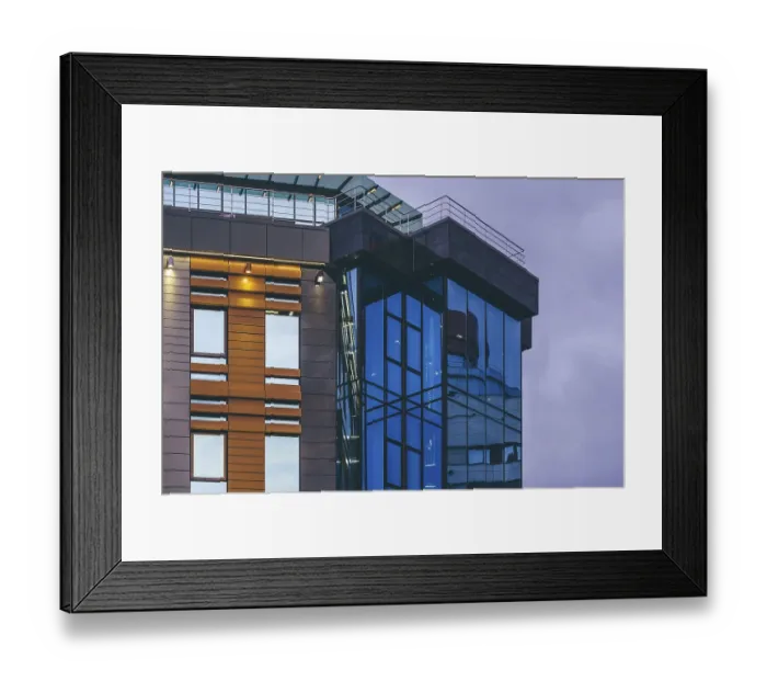 Framed Print : Modern high-rise office building with a glass facade Framed Print : Modern high-rise office building with a glass facade