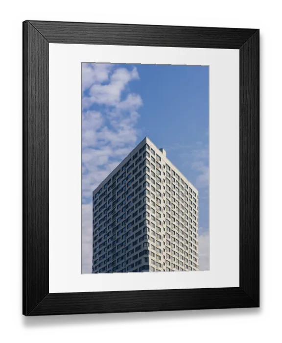 Framed Print : Modern Skyscraper on the Cloudy Sky Background