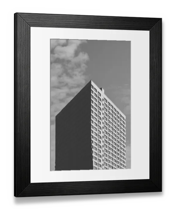 Framed Print : Black and White Skyscraper on the Cloudy Sky Background Framed Print : Black and White Skyscraper on the Cloudy Sky Background