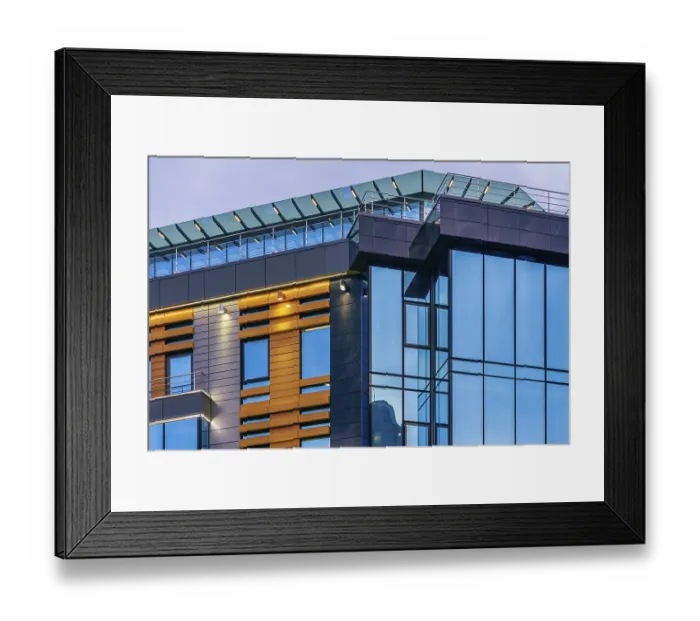 Framed Print : Modern high-rise office building with a glass facade at overcast