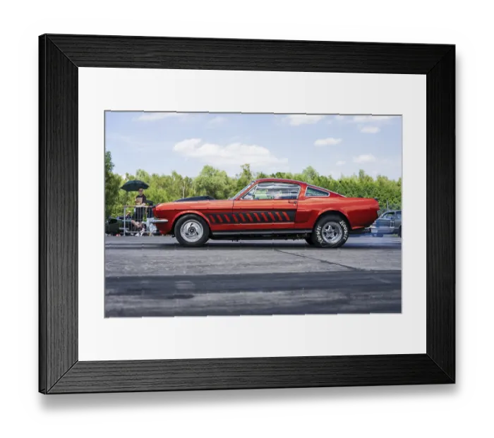 Framed Print : FINOWFURT, GERMANY - JUNE 28, 2024: A muscle car Ford Mustang (first generation)