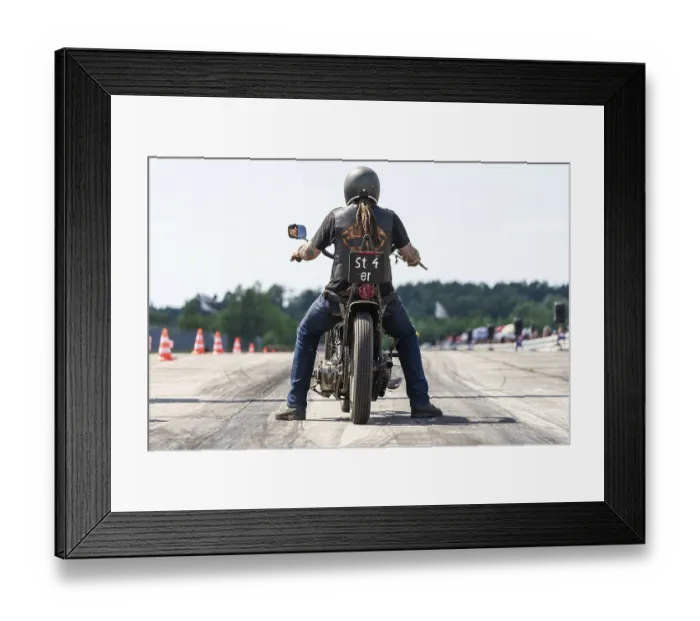 Framed Print : FINOWFURT, GERMANY - JUNE 28, 2024: The motorcycle racer on the racing line