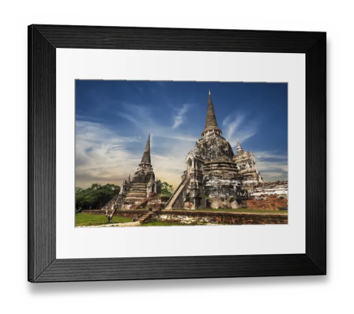 Framed Print : Asian religious architecture. Ancient Buddhist pagoda ruins at Wat Phra Sri Sanphet temple under sunset sky