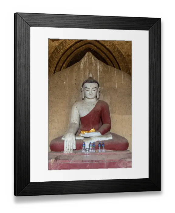 Framed Print : The interior of Buddhist Temple with statue of sitting Buddha