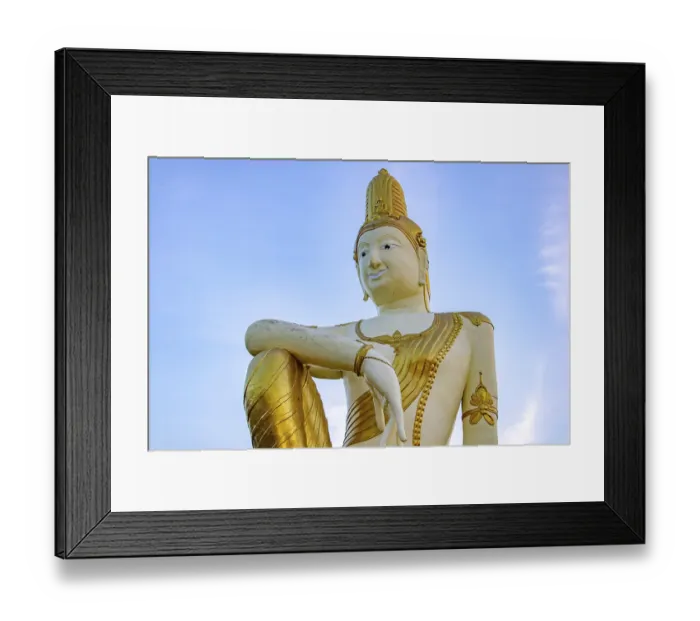 Framed Print : The statue of future Buddha Maitreya on blue background Framed Print : The statue of future Buddha Maitreya on blue background