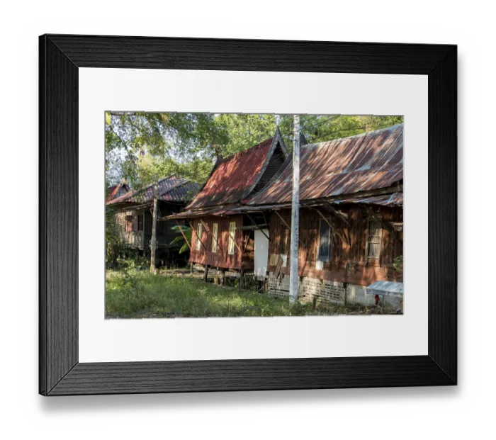 Framed Print : Wooden houses in the areal Buddhist monastery Wat Phai Rong Wua